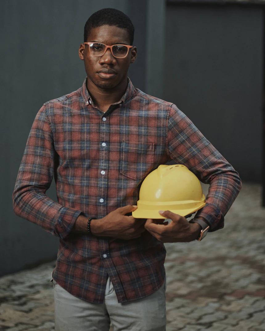 JL Handyman tradesman holding a hard hat before starting a job in San Francisco
